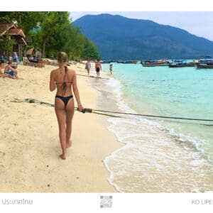 Woman walking on Ko Lipe beach.